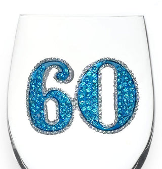 Rhinestone-encrusted "60" decal with silver border on the side of a clear wine glass