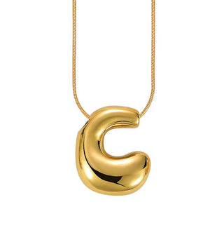 Gold bubble letter "C" pendant on gold cable chain