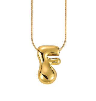 Gold bubble letter "F" pendant on gold cable chain