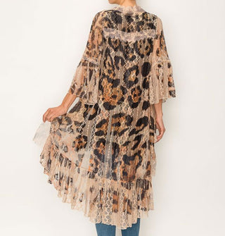 Model facing away from the camera wears a lace mid-length duster with enlarged leopard print