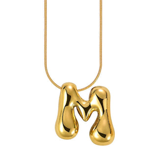 Gold bubble letter "M" pendant on gold cable chain