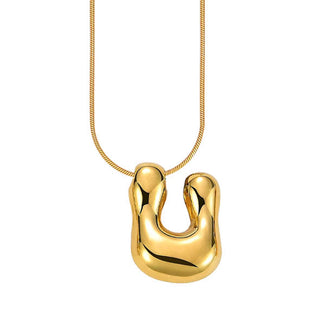 Gold bubble letter "U" pendant on gold cable chain