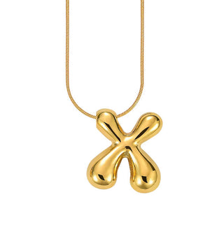 Gold bubble letter "X" pendant on gold cable chain