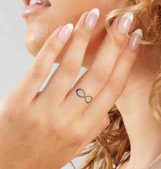 Model with hand upraised to face has a figure 8 tattoo on middle finger