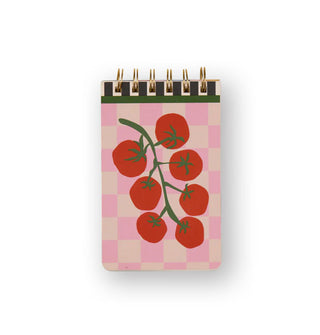 Spiral-bound notepad features illustration of tomatoes on the vine against a pink plaid backdrop with green upper trim
