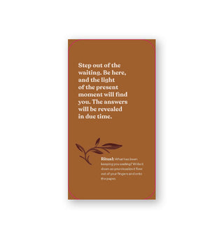 Rectangular copper-colored card says, "Step out of the waiting. Be here, and the light of the present moment will find you. The answers will be revealed in due time."
