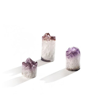 Grouping of three cylindrical amethyst "cupcakes" in varying sizes and patterning