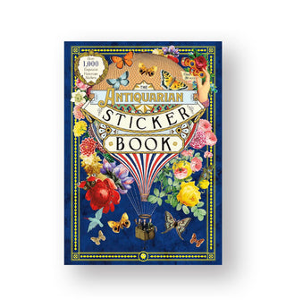 Dark blue cover of The Antiquarian Sticker Book is lushly illustrated with colorful designs of flowers, butterflies, and a central hot air balloon