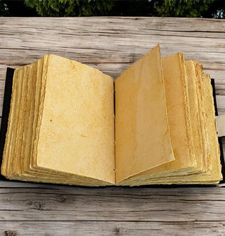 Opened notebook with rough deckle edge pages