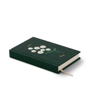 Three-quarter view of the April mini hardcover notebook with daisies embroidery