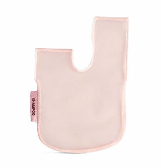 Light pink meshy bag with oblong U shape and attached sparkly pink tag that says, "Shampoo"