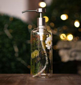 Glass soap dispenser with stainless steel pump top features a painted design of wildflowers and bumblebees