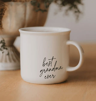 White ceramic mug with flared rim says, "Best grandma ever" near the bottom in black script lettering