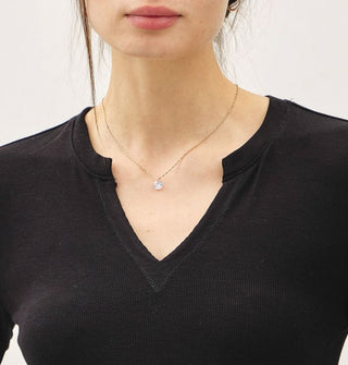 Model wears a black V-neck top
