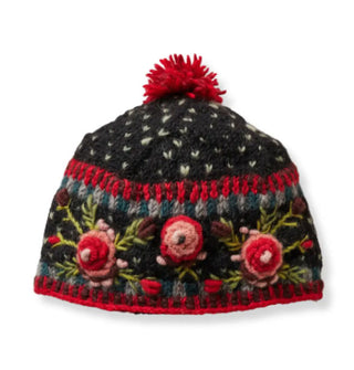 Black wool beanie with textural pink, red, and green floral embroidery, geometric border designs, and a red pom pom on top