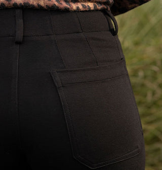 Black of black pants shows dart details