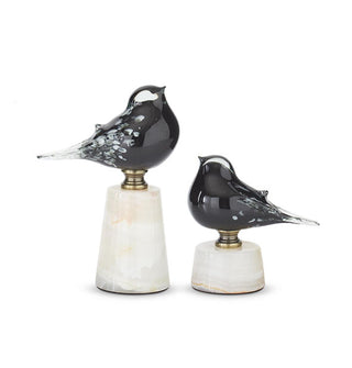 Set of two flecked black glass bird figurines affixed to marble bases with metal hardware