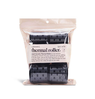 Light pink pack of black Ceramic Kitsch Thermal Rollers with clear window through which rollers can be seen