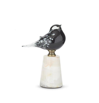 Large flecked black glass bird figurine affixed to a marble base with metal hardware