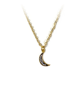 Black crescent moon pendant with small embedded crystals on a gold chain