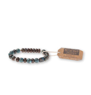 Blue sky jasper stone bead bracelet with brown tag attached