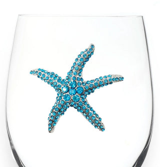 Blue rhinestone-encrusted starfish decal on the bowl of a clear wine glass
