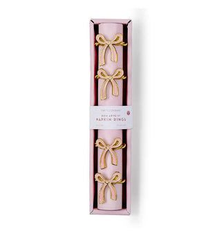 Long rectangular box of gold napkin rings with bow accents