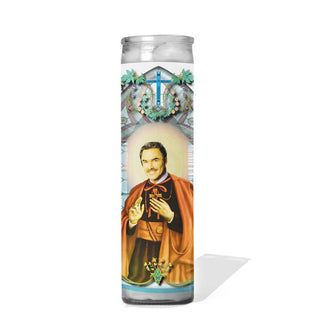 Tall glass prayer candle with colorful label depicting Burt Reynolds as a saint