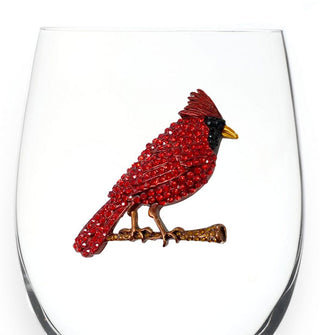 Red jewel-encrusted cardinal bird decal on the bowl of a clear wine glass