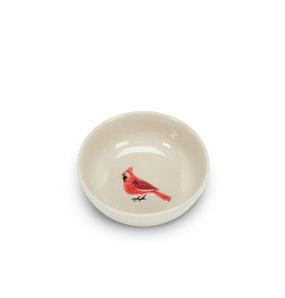 Round white ceramic bowl with embossed painted red cardinal graphic in the center