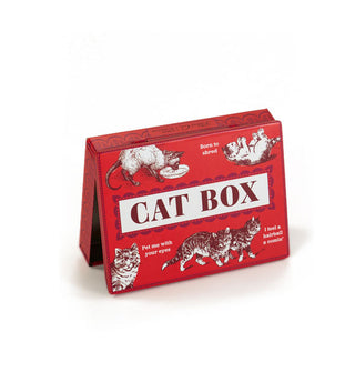 Flat red rectangular box says, "Cat Box" and features illustrations of cats with funny captions