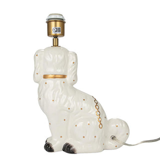 Back of ceramic Staffordshire dog table lamp base shows socket and cord entry point