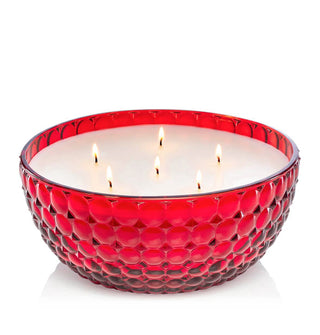 Lit six-wick bowl-style candle in a red bubble glass vessel