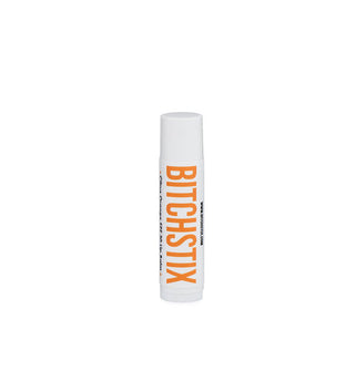 White tube of Bitchstix lip balm with large orange lettering