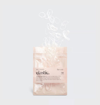 Pack of 100 clear Kitsch No-Snag hair elastics, with some spilling out the top