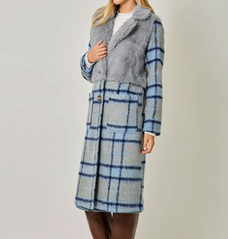 Model wears a blue and gray plaid brushed fiber coat with solid gray faux fur bodice