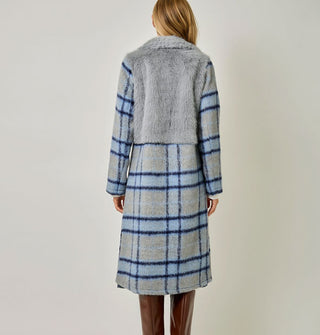 Model wears a blue and gray plaid brushed fiber coat with solid gray faux fur bodice
