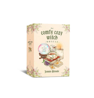 Box of The Comfy Cozy Witch Oracle cards by Jennie Blonde features central whimsical illustration of a teacup, crystal ball, candle, book, fruit, and card deck