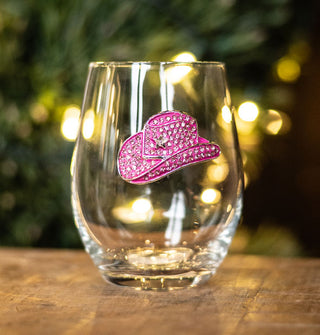 Clear stemless wine glass features a pink cowgirl hat decal accented with rhinestones and a star