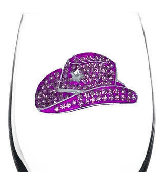 Pink cowgirl hat decal encrusted with small round rhinestones and one star-shaped rhinestone on the side of a clear wine glass