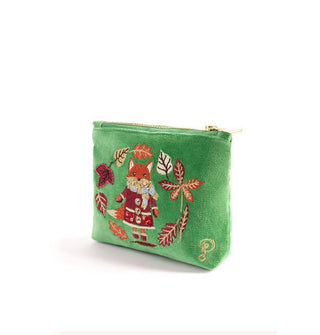 Green velvet pouch features embroidery depicting a fox wearing coat, boots, scarf, and mittens encircled by fall leaves