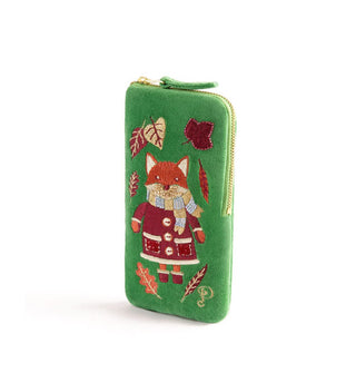 Rectangular green velvet eyeglass case with gold zipper and front embroidery of a fox wearing a coat, scarf, mittens, and boots, encircled by autumn leaves