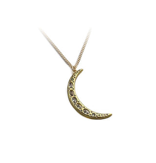 Gold crescent moon pendant with embedded crystals of varying sizes on a gold chain