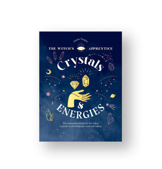 Blue cover of The Witch's Apprentice: Crystals & Energies features a central illustration of two faceted gemstones hovering above an opened hand 