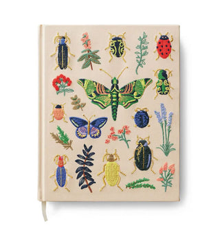 Cream-colored book cover with colorful plant, butterfly, beetle, and bug embroidery