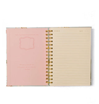 Opened spiral-bound notebook with pink cover interior and lined page with "Subject" and "Date" fields