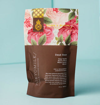 Bag of TokyoMilk Dead Sexy bath salt soak is printed with its key fragrance notes: Deep Vanilla, Exotic Wood, White Orchid, Ebony