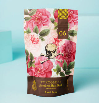 Bag of TokyoMilk Decadent Salt Soak in Dead Sexy scent features lush pink floral designs and a central skull and crossbones illustration