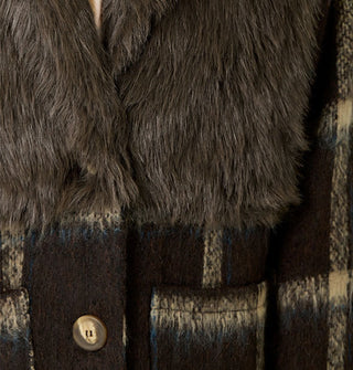 Closeup of faux fur and brushed texture of a brown and tan plaid coat