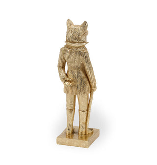 Back of a gold statue of a fox wearing glasses, a jacket, pants, boots, and holding a cane, standing on a square base